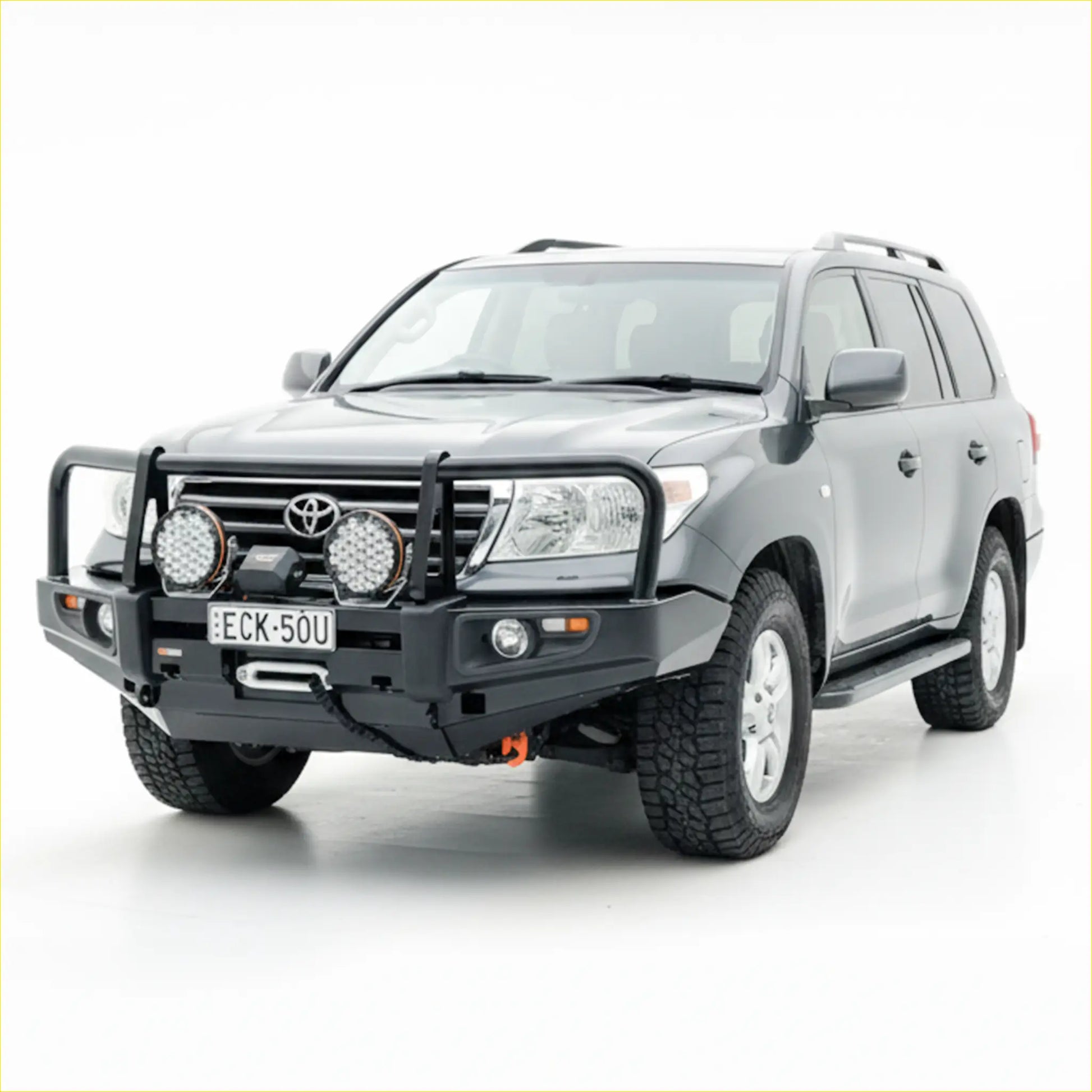 Black rugged steel rockarmor front bumper with led lights and winch mount fitted to silver toyota landcruiser 200 gx/gxl