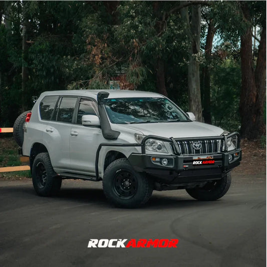 White Toyota Prado with black accessories and premium steel bullbar for fog light enhancement