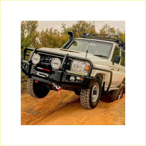 Black rock autoguard steel bullbar with round headlights and winch hook on white toyota landcruiser 4wd ute offroad