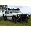 White toyota land cruiser 4wd with black steel rockarmor bullbar and roof rack for offroad tough ute use