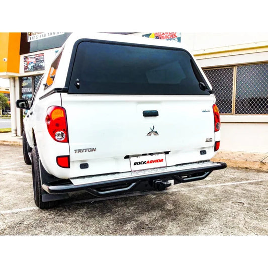 White Mitsubishi Triton pickup truck with Rockarmor Premium Steel Rear Step Tow Bar