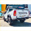 White toyota hilux ute with black rockarmor steel rear step tow bar and roof rack for offroad 4wd use