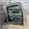 Black plastic rockarmor rear door dropdown table and pantry with fold-down shelf mounted in toyota prado 150 trunk