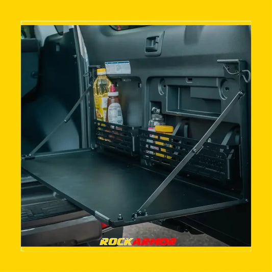 Black foldable truck bed table with metal arms and storage baskets for toyota prado 150 rear door use