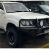 White toyota land cruiser with black gt hoop bullbar and rock sliders from rockarmor rock pack 100 series