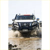 White Nissan st-30 pickup with black GT hoop bullbar front guard and roof rack from Rockarmor Rock Pack for Navara NP300