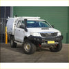 White toyota hilux n70 2011-2015 with black gt hoopless bullbar roof rack and rock sliders side steps from rockarmor rock pack