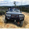 Black toyota landcruiser fj80 with rugged rockarmor rock pack bullbar and rock sliders for off-road toughness
