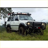 White toyota land cruiser fj80 with black metal bullbar and roof rack from rockarmor rock pack premium set