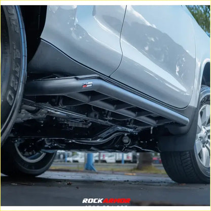 Black metal rockarmor rock sliders side steps with rugged design and logo for prado 150 2009-2024 underbody protection