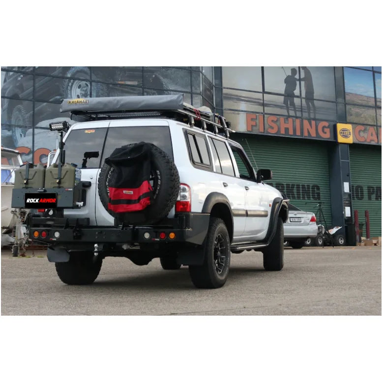 White off-road vehicle with Rockarmor Steel Dual Wheel Carrier for Nissan Patrol Y61