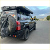 Black nissan patrol y61 with rockarmor steel dual wheel carrier mounted on rear for 4wd offroad use