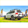Silver toyota land cruiser 300 with black roof rack and rockarmor steel dual wheel carrier on rear for offroad 4wd use