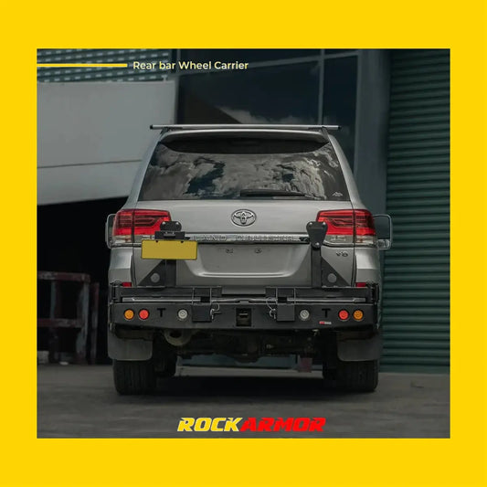 Black metal rockarmor steel dual wheel carrier mounted on rear bar of silver toyota landcruiser fj200 back view