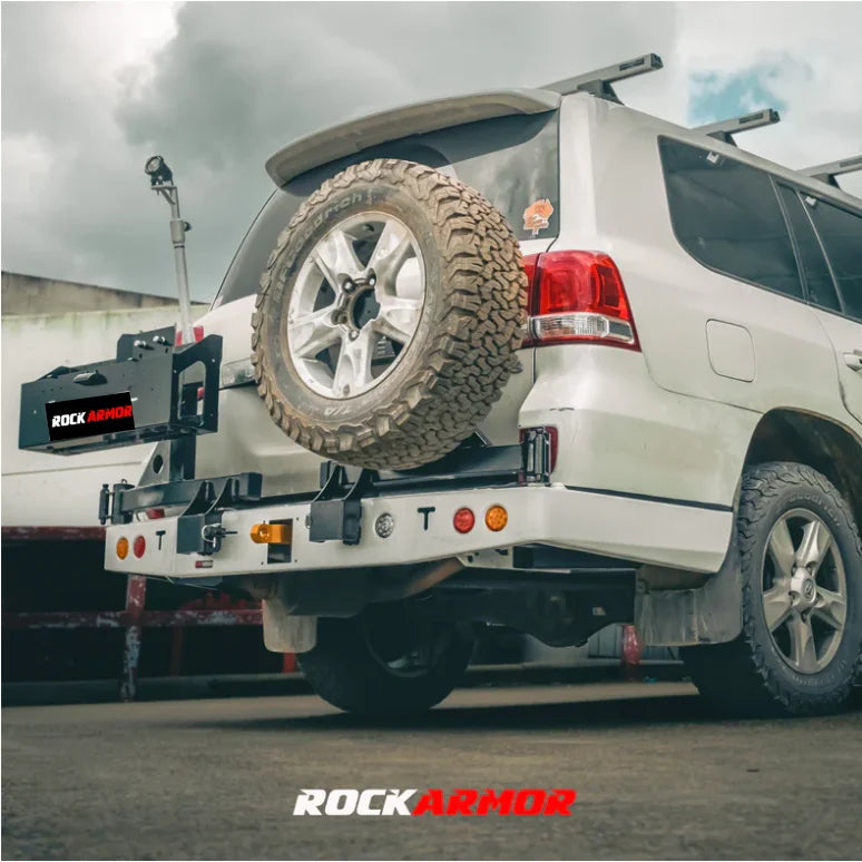 White SUV with spare wheel mounted on rear bar using Rockarmor Steel Dual Wheel Carrier