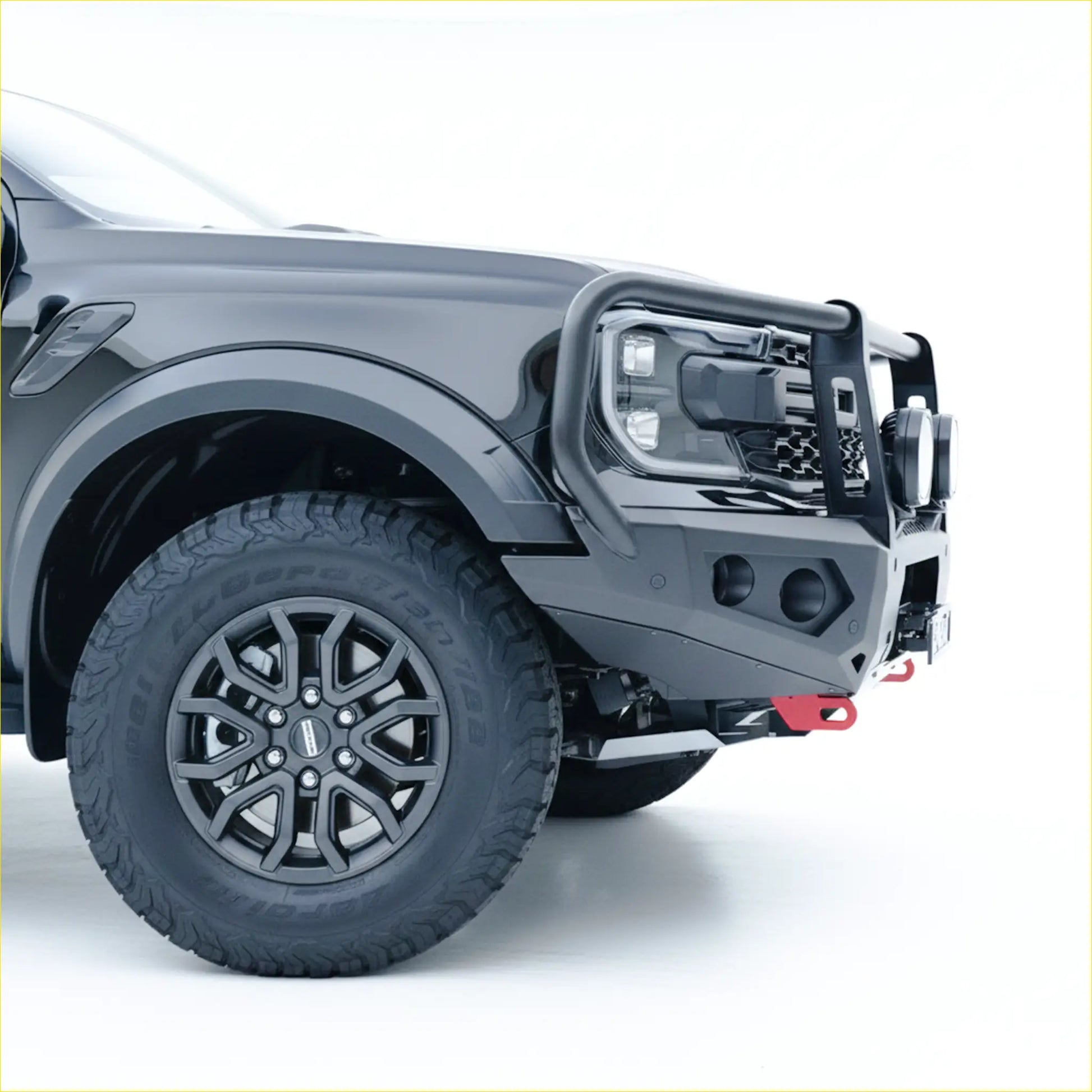 Black matte steel rockarmor gt hoop bull bar with integrated led lights and red tow hooks for ranger raptor 2023+