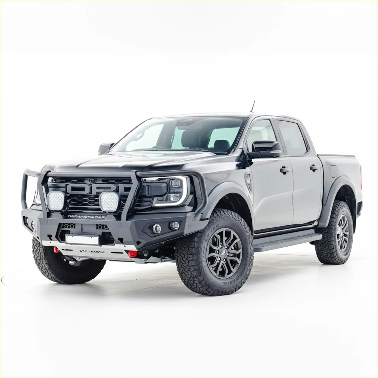 Gray ford raptor with black rockarmor steel gt hoop bull bar and rugged off-road tires for ranger raptor 2023+