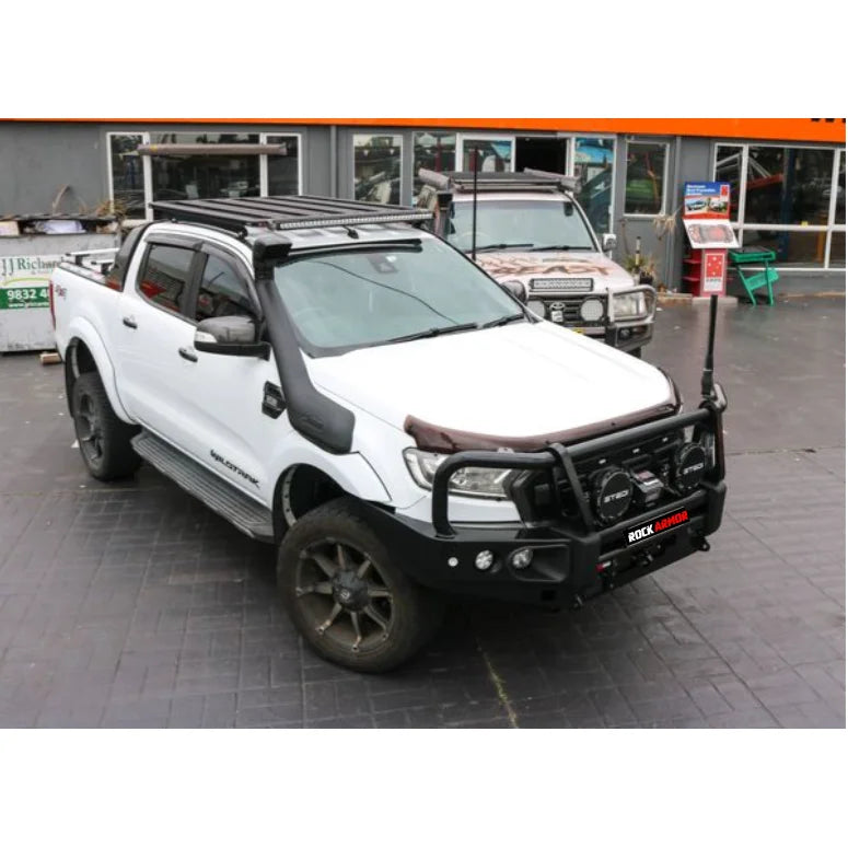 White pickup truck with off-road modifications and steel checker plate Rockslider side steps