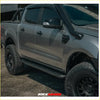 Gray metallic ford ranger ute with black offroad tires featuring rockarmor steel rockslider side steps for 4wd use