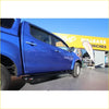 Blue holden colorado ute with black rockarmor steel rockslider side steps for 4wd offroad use back side view
