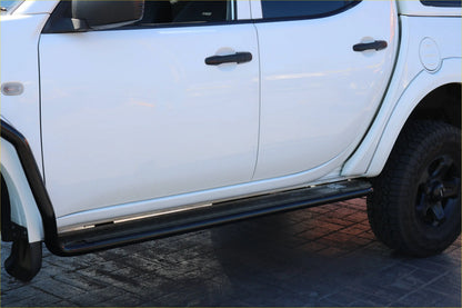 Black steel rockarmor side step running along the lower edge of a white mitsubishi triton ml/mn door