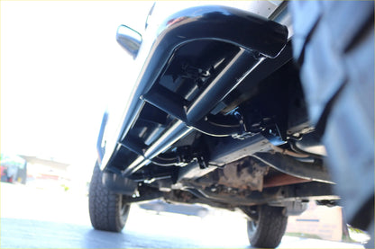 Black steel tubular underbody guard mounted beneath mitsubishi triton ml mn for rockarmor rockslider side steps