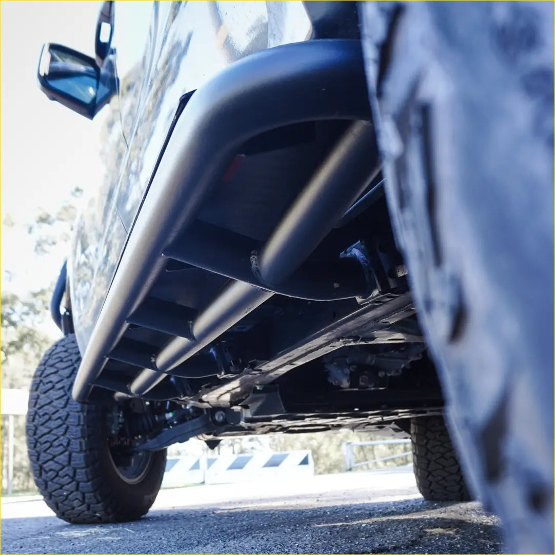 Black matte steel rockarmor rockslider side steps for mitsubishi triton mv showing underbody protection kit back side