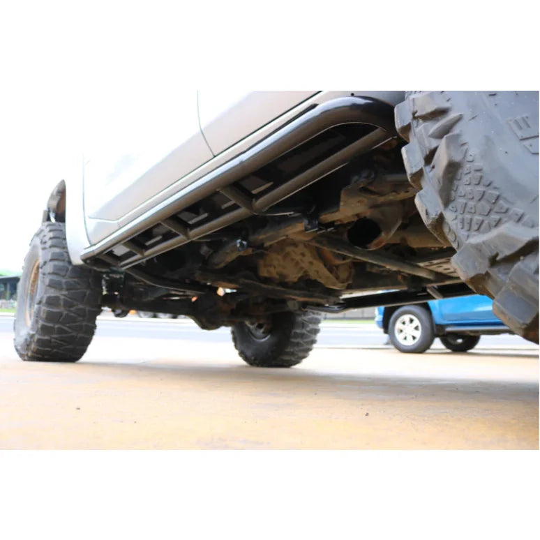 Truck undercarriage with oversized tires featuring steel checker plate side steps and fitting video