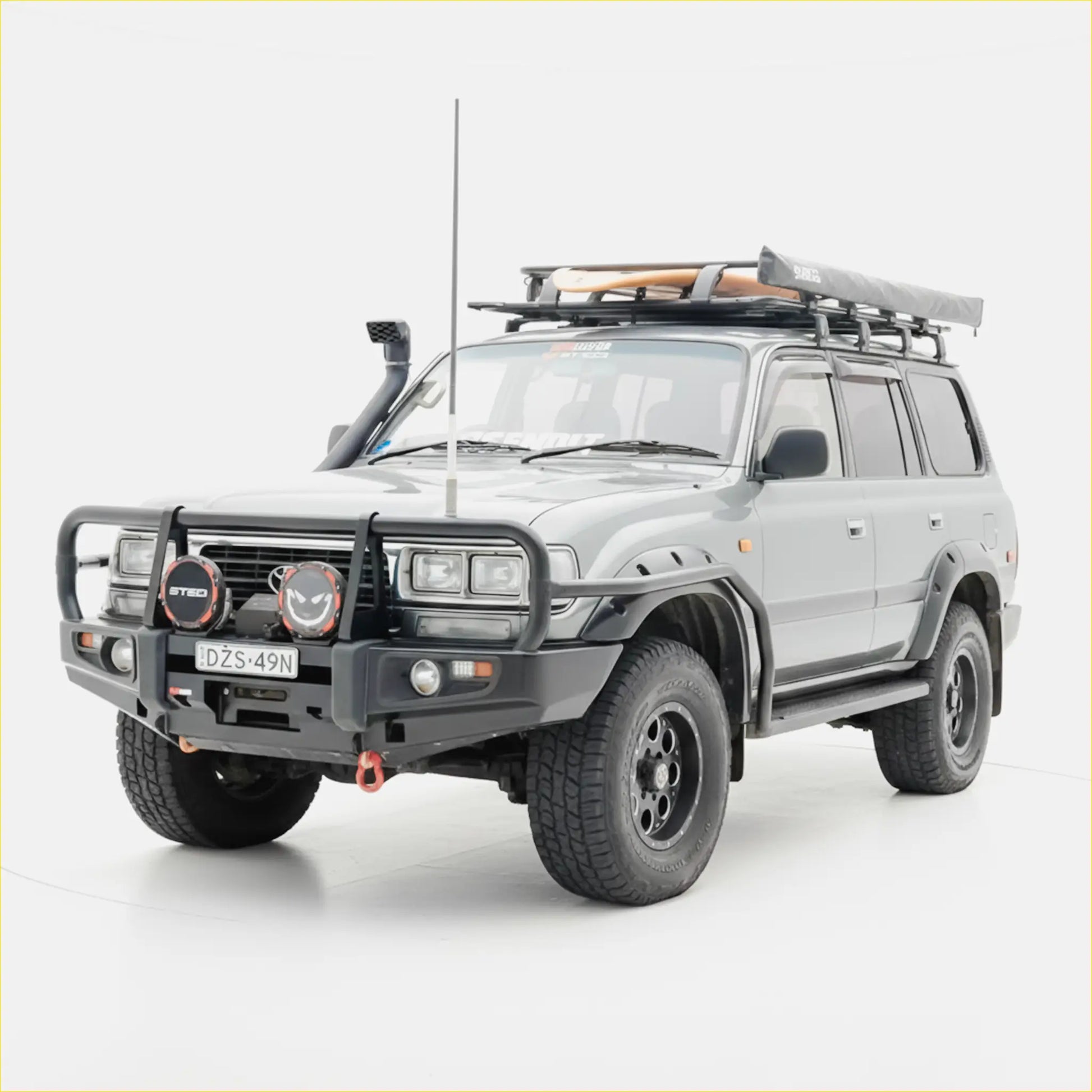 Silver toyota land cruiser 70 series suv with black steel rockarmr premium bullbar and roof rack off-road setup