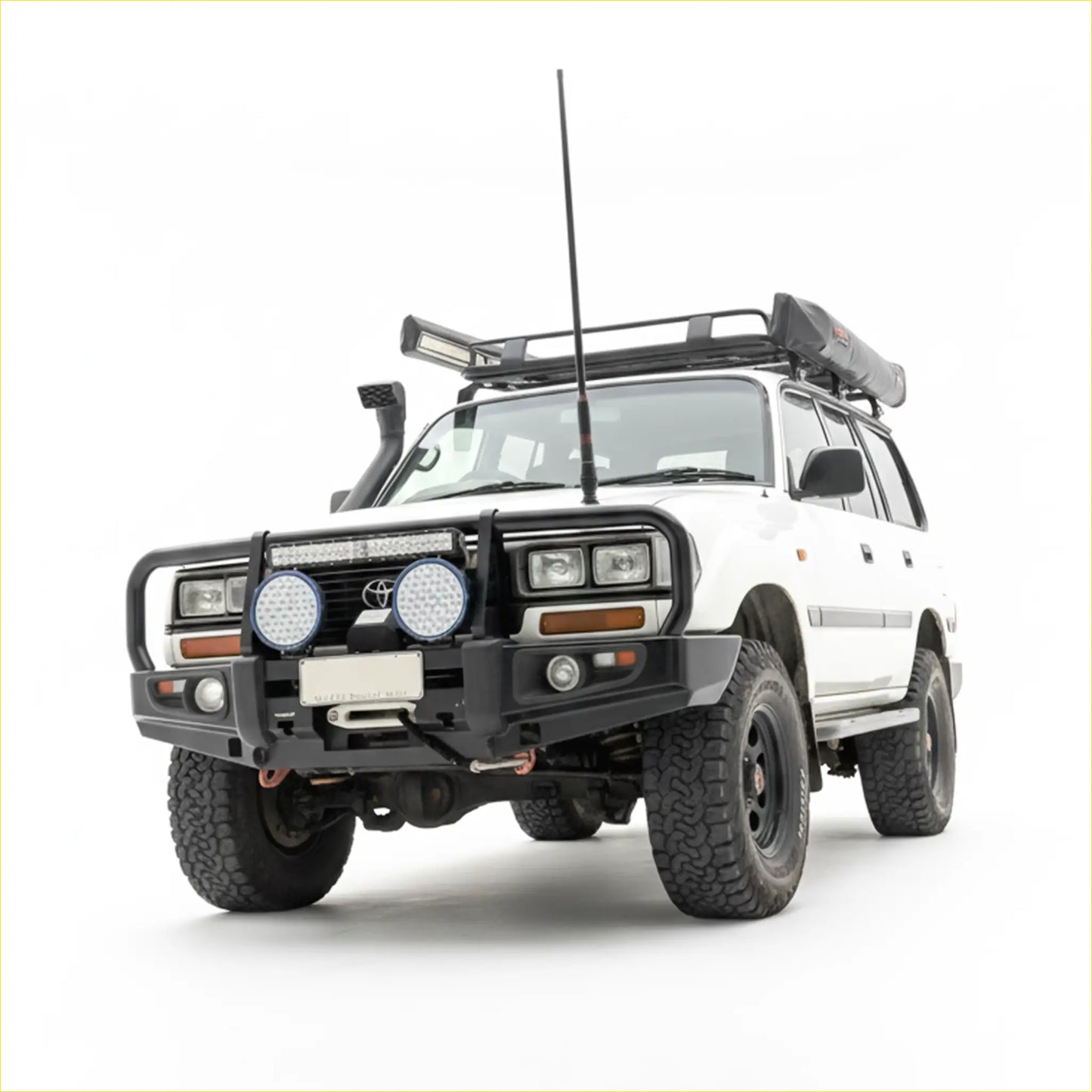 White toyota land cruiser with black steel rockarmr premium bullbar and roof rack for off-road use