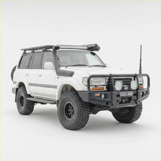 White toyota land cruiser 100 with black rockarmr premium steel bullbar and rugged off-road tires