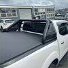 Black perforated steel roll bar sport bar with integrated side rails on the back of a white gwm cannon alpha 2024 truck