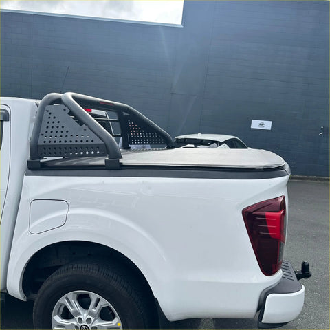 White isuzu d-max 2024 pickup truck backside with black perforated metal roll bar and matching tonneau cover