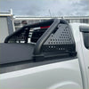 Black perforated metal roll bar with curved bars and brackets for toyota hilux 2015-2020 truck bed rail back view