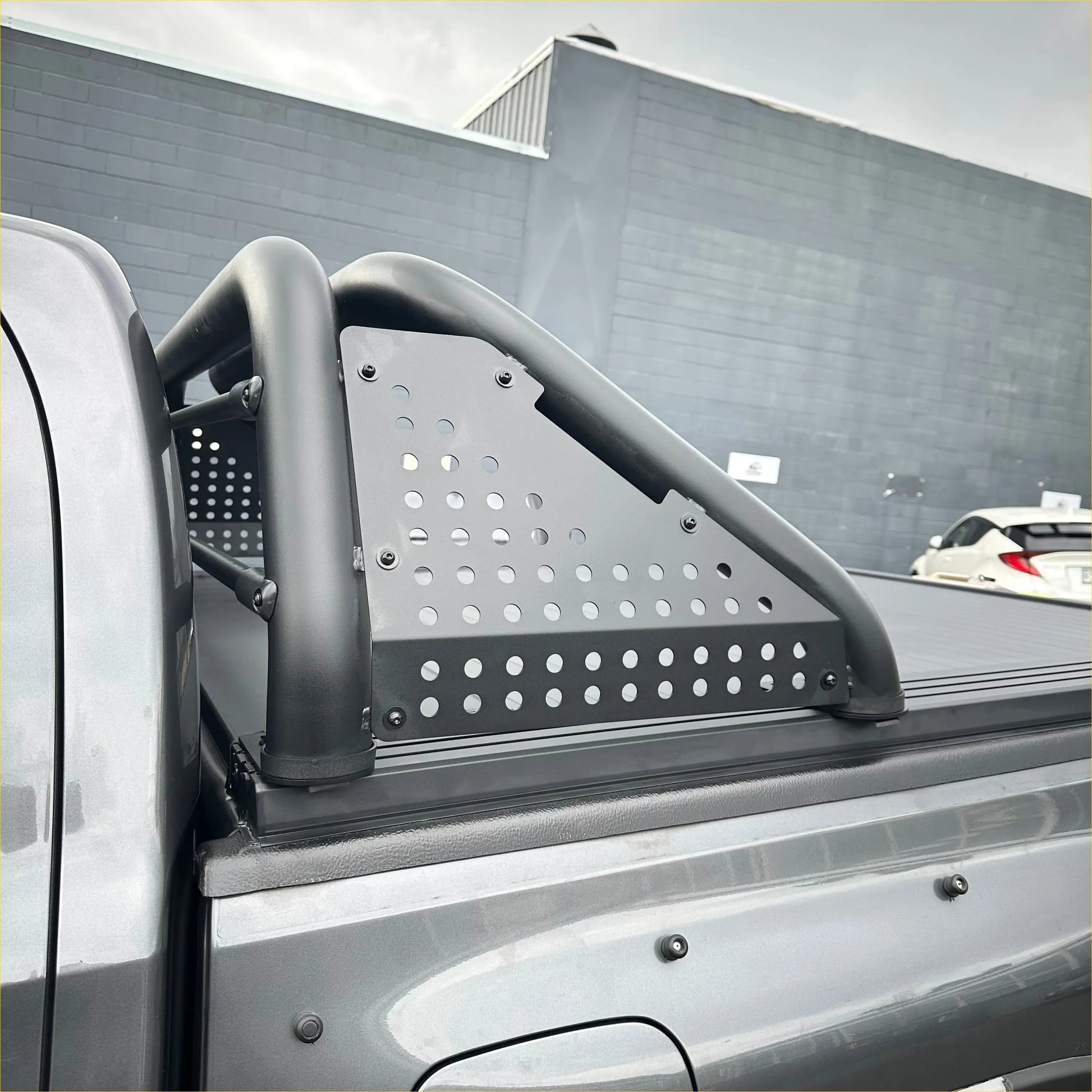 Black perforated metal roll bar t10 with curved tubular side bars on back side for ford ranger 2022+ truck bed rail