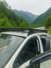 Black heavy duty roof rack with integrated led lights mounted on the back of a white ford ranger 2022+