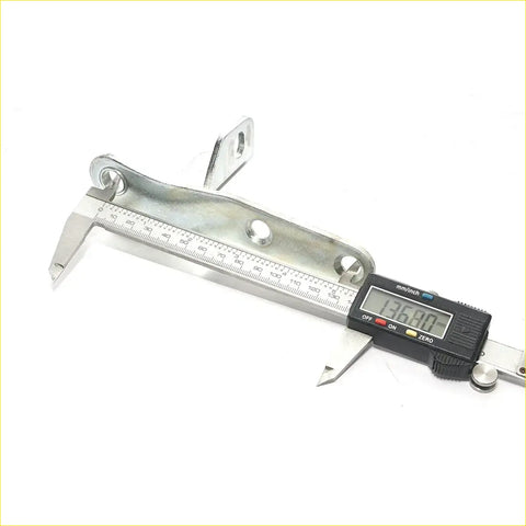 A black and silver digital caliper measuring rr tail gate hinge assembly for toyota hilux revo 2015-2023 in millimeters