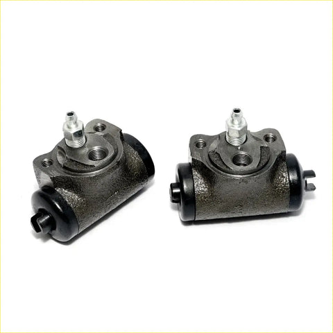 Pair of dark gray cast iron drum brake cylinder assemblies with black seals and silver fittings for mitsubishi debonair
