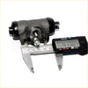 Black cast iron rr wheel brake cylinder for mitsubishi delica l300 with textured surface and threaded ports measured at 41.38 mm