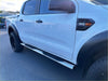 Silver metallic 4 inch oval stainless steel running board side step bars on white ford ranger double cab truck