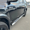 Shiny chrome stainless steel 4 inch oval tube running board with textured grip panels on black hilux 2015-current