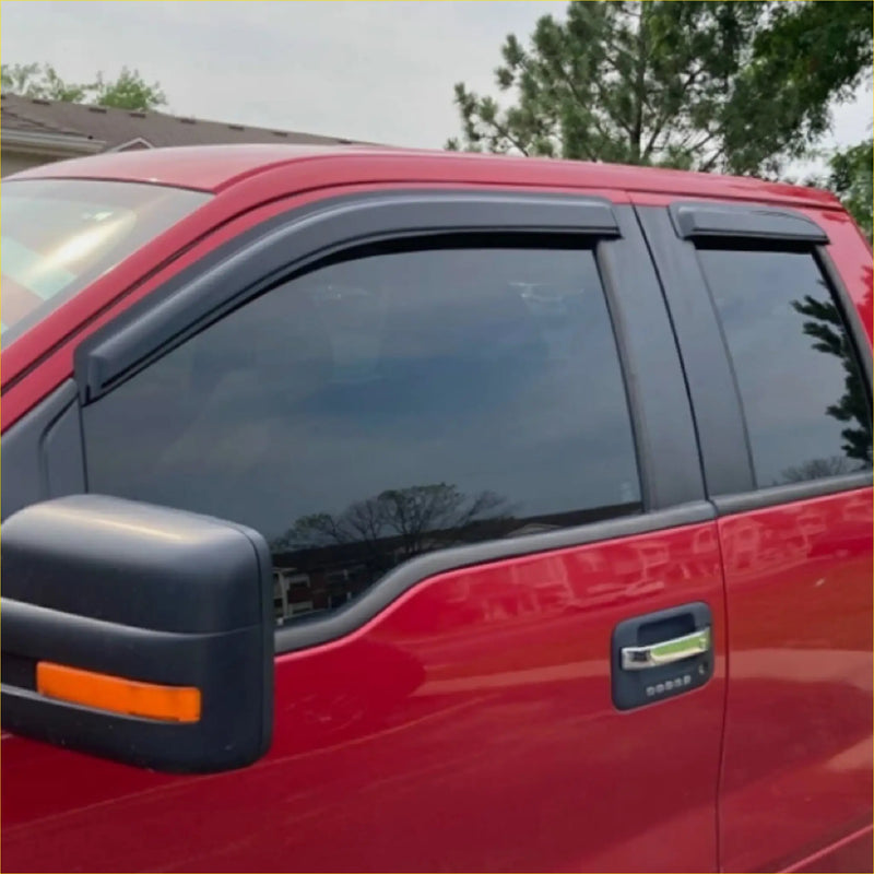 Black rubber window visors installed on a red 2022 ford ranger super cab pickup truck for sun and rain protection