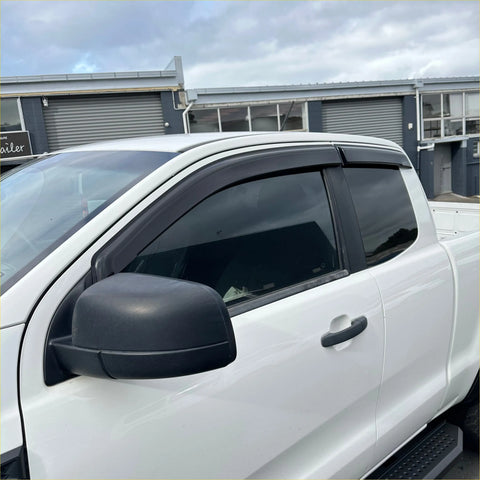 Black plastic window visors installed on a white ford ranger px1 px2 px3 2012-2021 super cab pickup truck