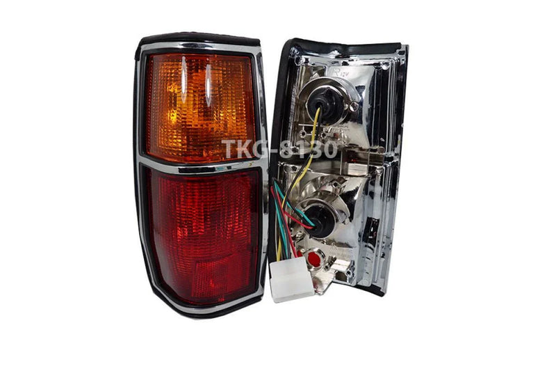 Nissan Datsun 720 2 x Tail Light Lamps Chrome Black Trim (1982-1984)