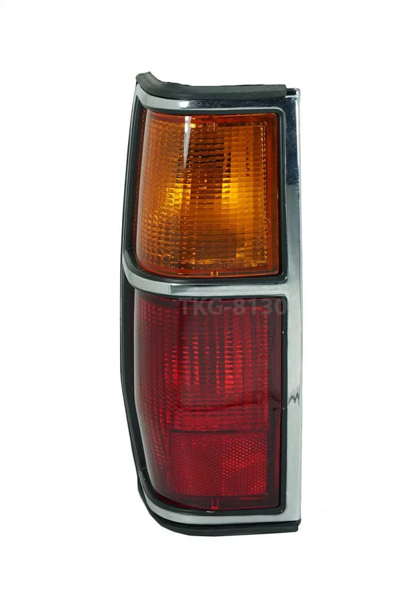 Nissan Datsun 720 Left Tail Light Lamp Chrome Black Trim (1982-1984)