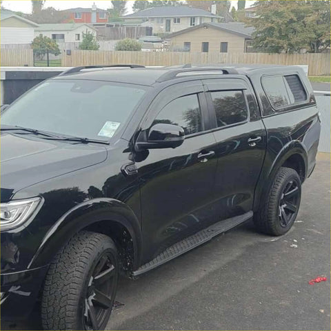 Black matte finish gwm cannon 2019 plus pickup truck shown from the back with window monsoons weather shields installed