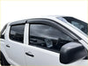 Black plastic window visors installed on white toyota hilux vigo for weather protection and style enhancement