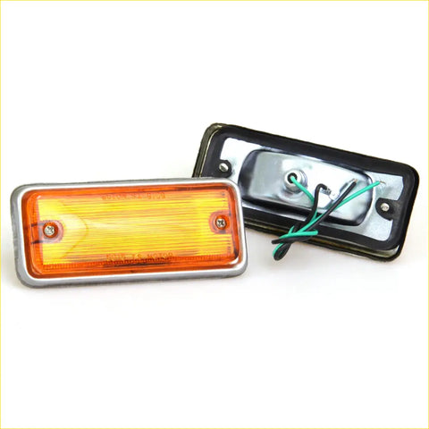 Back side of rectangular amber led side marker light with silver metal frame and black housing for nissan datsun 620 utility