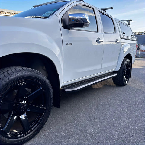 White isuzu d-max 2021-current with black steel side step running board and black alloy wheels pickup truck view