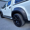 Black matte fender flare on white pickup truck with side step running board oem style colorado 2012-2020 double cab